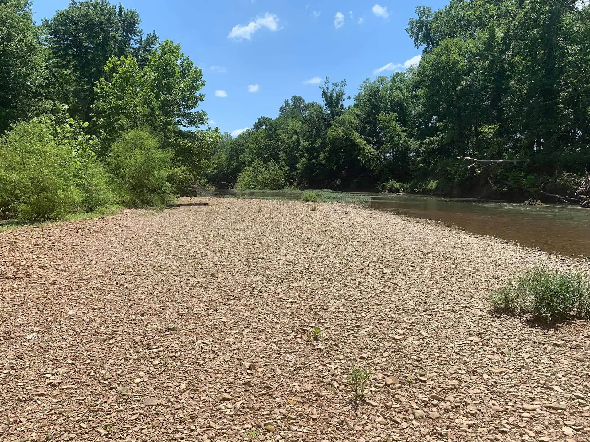 A wide gravel bar along the Sac River, room to spread out for wading and fishing